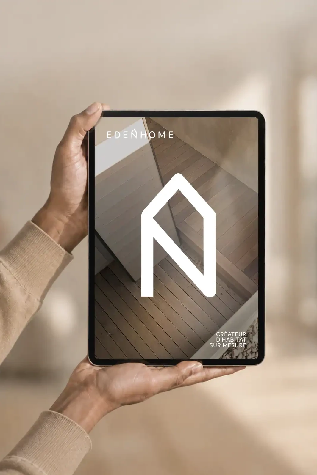 Identité visuelle Eden Home présentée sur une tablette avec le symbole de maison