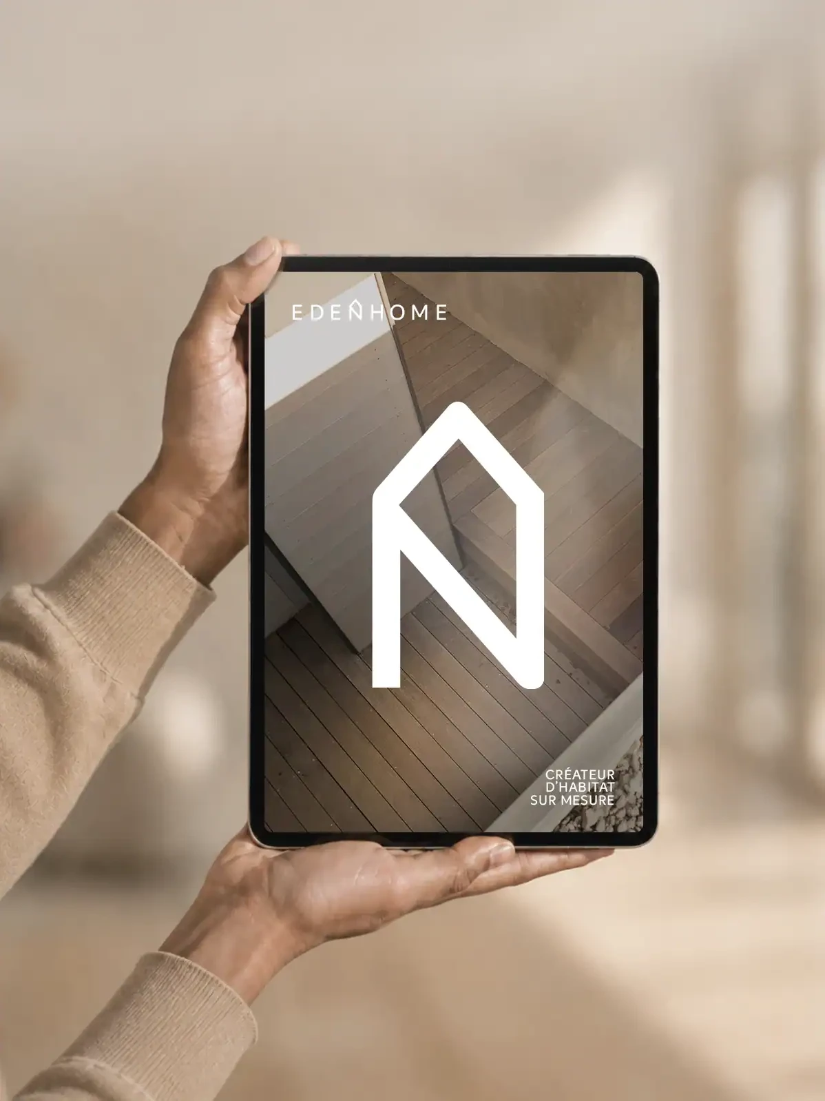 Identité visuelle Eden Home présentée sur une tablette avec le symbole de maison